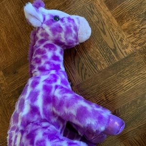 purple giraffe stuffed animal with bow